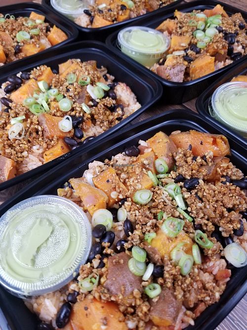 Rice bowl with black beans, sweet potato, walnut chorizo, avocado crema at Plant Power Nashville  in Brentwood