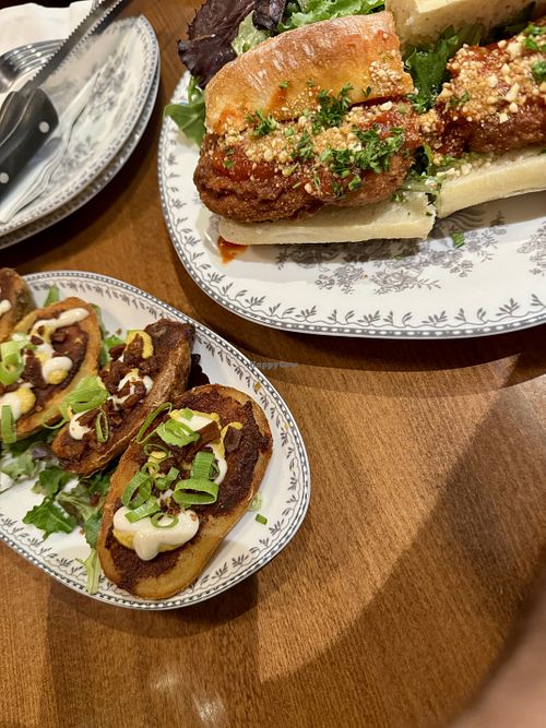 potato skins + chick’n parm sandwich  at DC Vegan in Washington