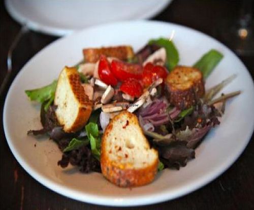 Garden Salad: Farm fresh mixed greens with red onions, mushrooms, tomatoes and Semifreddi's garlic croutons at Patxi's Pizza - Hayes Valley in San Francisco