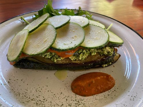 Cold “lasagna” with aubergine, zucchini, tofu dressed with pesto, and tomato sauce  at De Raiz in Santiago
