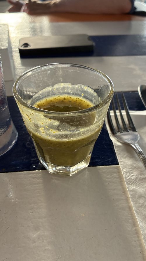 Complimentary shot of pepper pot soup after a sip  at Miss Lily's in Negril