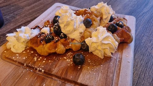 Waffles with cream and blueberries at Love Peace & Coffee in Edinburgh