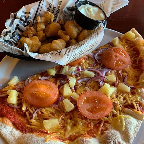 Vegan pizza and cauliflower wings.  at pubi.fi in Ivalo