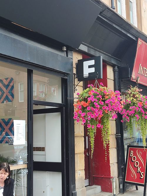 Sign with flower basket at Frankie Coffee in Glasgow
