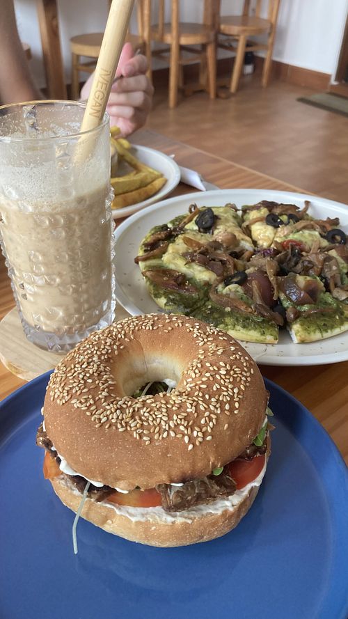 Best combo! Coconut coffee, pesto pizza and tempeh bagel😍  at iVegan Supershop Da Nang - Healthy Plant Based Cafe in Da Nang