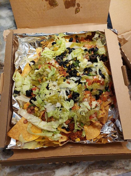 Pizza box full of vegan nachos at NachoRita in Lombard