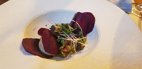 Raw beet ravioli stuffed with cashew cheese and herbs with roasted yellow peppers sauce at Ca n'Ela Vegan Restaurant in Mallorca