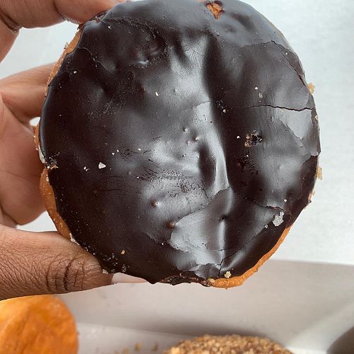 Chocolate donut with cream filling at Jenny's Donuts in Redlands