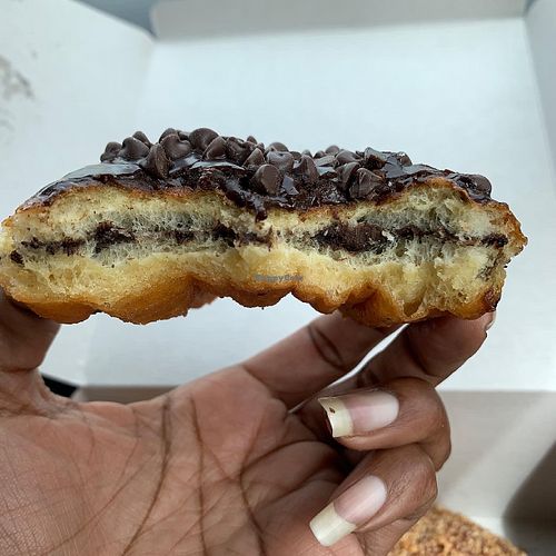 Inside of chocolate donut topped with chocolate chips at Jenny's Donuts in Redlands