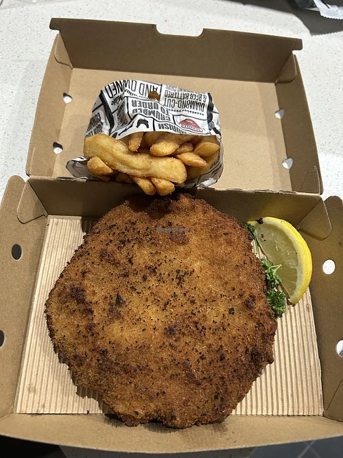 Vegan schnitzel and chips. The schnitzel was crispy and tasty, and their fries are really good as well    at Schnitz in Mill Park