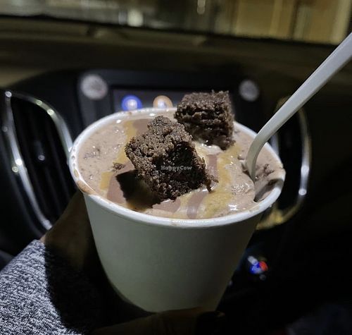 Handshake with chocolate cake pieces and caramel   at Vaca's Creamery in Chicago