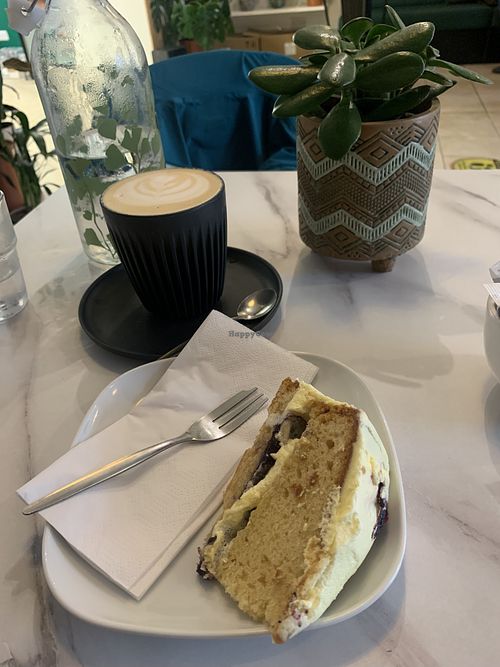 Vegan lemon and blueberry cake and oat milk latte  at Moka  in Ardrossan