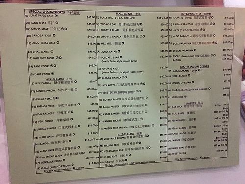 menu (see Jain and Vegan symbols) at Sharmaji Indian Veggie Restaurant in Kowloon