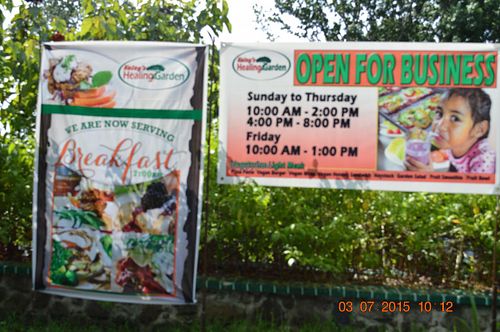 Timings written on the Sign board. at Katey's Healing Garden in Palau