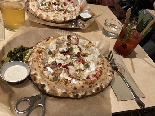 Posh pizza with Black Cherry drink  at Gemello Vegan Pizza in Berlin