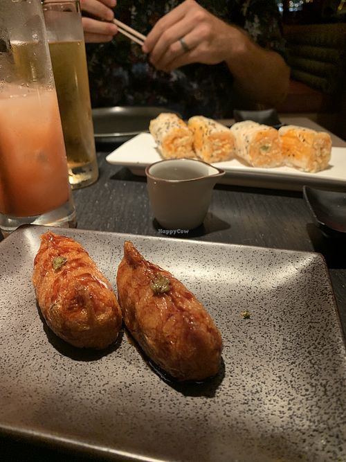 Shitaki bacon inari and baked crab roll. Both were so good!  at PLANTA Queen in New York City