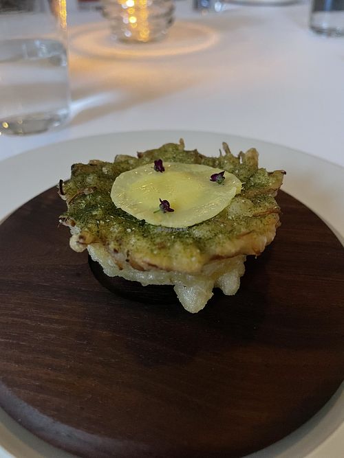 Artichoke heart prepared with many ingredients I have never heard of. Delish   at Eleven Madison Park in New York City
