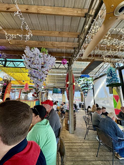 turns into a holiday bar during the holidays 🎄🎅🏽  at The Deck Beach Bar and Kitchen in Tybee Island