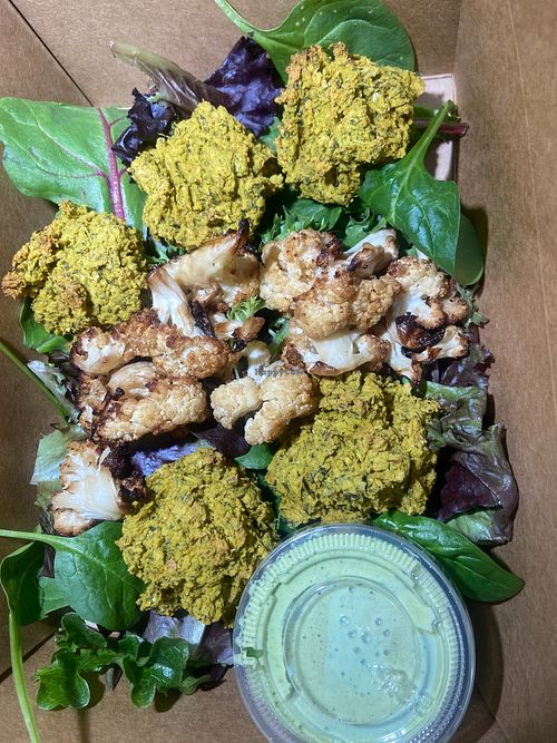 Baked Falafel and Roasted Cauli over Greens with Cilanteo Lime Cream Sauce at Nourishing Empowerment in Cypress
