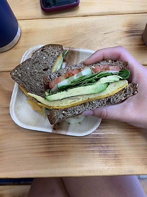 Just egg, follow your heart cheddar, avocado, cucumber and tomato on whole grain bread!  at Roots Lounge in Toms River