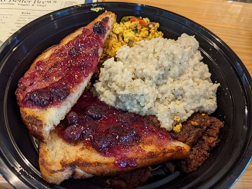 Breakfast combo with grits, tofu scramble, breakfast sausage & toast at Mo' Brunch + Brews in Houston