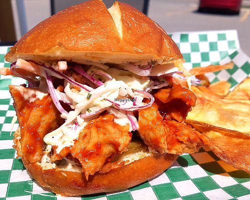 Chipotle IPA BBQ Chikun
Big tender pieces of Chunky Chikun coated in our house made Chipotle IPA BBQ sauce topped with a Ranch Slaw and pickled Jalapenos on a Pretzel bun. at Chikun Shak in Mount Brydges