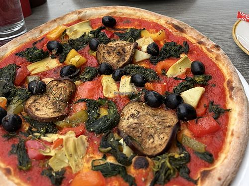 Vegetarian pizza no cheese.. they offered to add something so I added olives  at Luna Piccante in Wilderswil