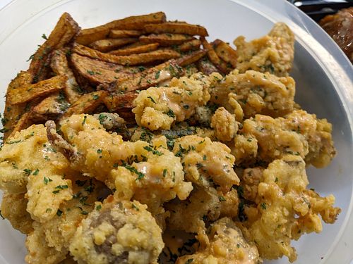 Delicious fried oyster mushrooms plate with fries, side salad not pictured. It's the deconstructed oyster mushrooms po-boy; I didn't want bread today. at Kales Kitchen  in Houston