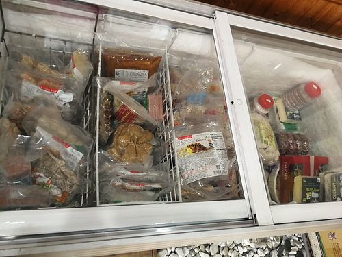 frozen items for sale (mock meats, vegan cheese, dumplings etc) at Loving Hut 愛家 in Jian