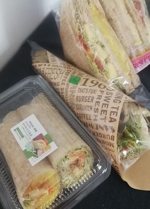 Packaged sandwiches and rolls for takeout at Loving Hut 愛家 in Jian