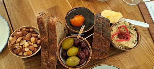 Olives, lemon hummus, black bean pate, smoked nuts at Hendersons in Edinburgh