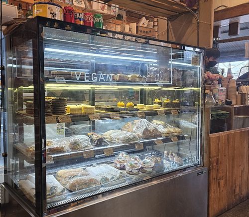 Clearly marked sweets such as raspberry frangipani slice, peanut butter cup.. at Fruits of Passion in Kensington