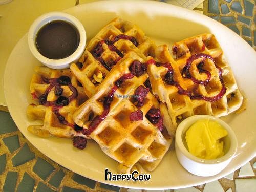 Vegan Cranberry Walnut Waffles with maple syrup and vegan spread at Morning Glory Cafe in Eugene