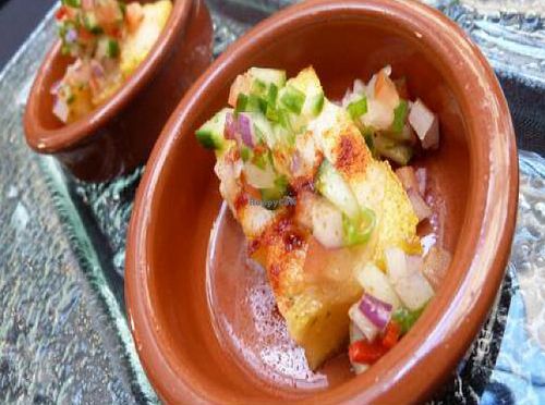 Spice dusted polenta with the restaurant's own vegan cheese and chilli salsa. at Hectors Restaurant in Auckland