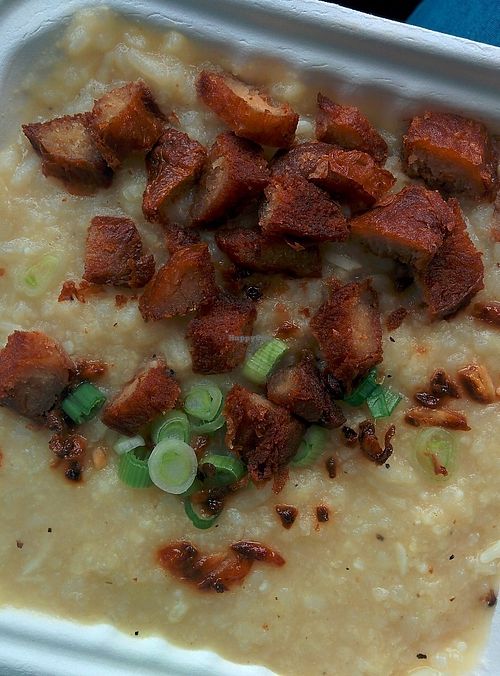 Lugaw: A hearty rice soup cooked in vegetable broth and ginger with fried soy chicken strips. Soup for the soul! at No Worries Cuisine in Oakland