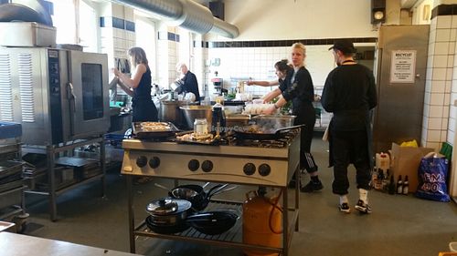In the Kitchen, Hard at work making good food! at Ungdomshuset Folkekøkken in Copenhagen