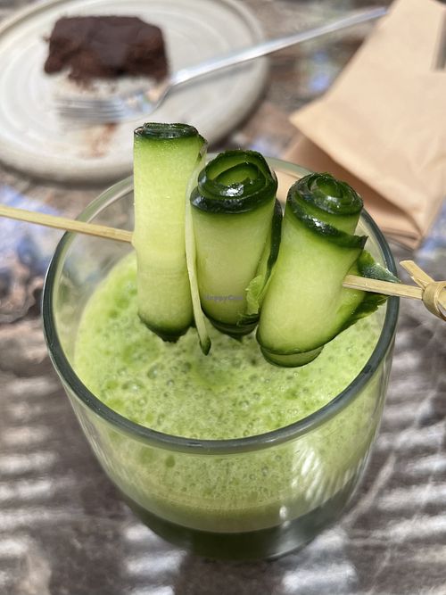 Detox juice and vegan brownie  at Almond in Paros