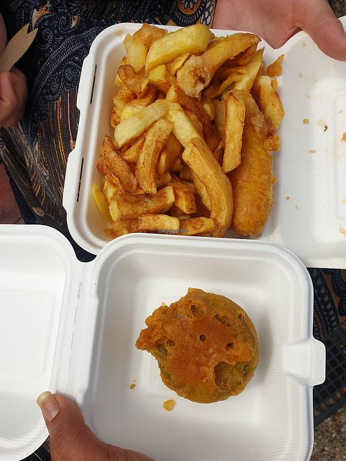 Chips, battered sausage and mushy peas fritter at The Harbour Chippy in Newquay