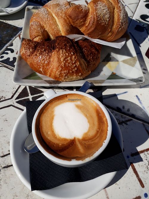 Cappuccino (soy milk) and chocolate croissant at Flower Park in Cagliari