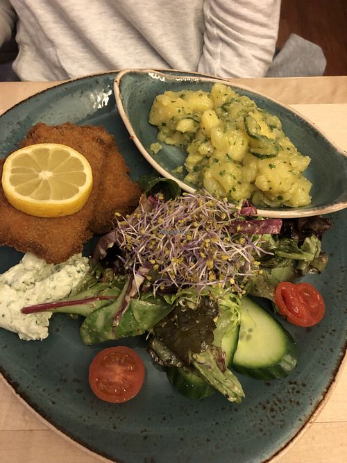 Schnitzel with cucumber potato salad at Max Pett in Munich