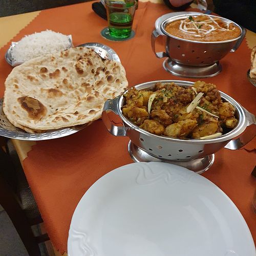 In the foreground: vegan aloo gobi, roti and rice at Buddha in Plzen