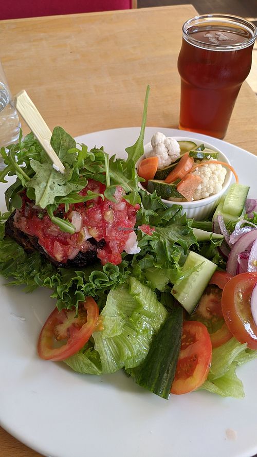 House open burger made vegan, with side salad instead of the fries. at The Merry Monk Gastropub in Merikarvia