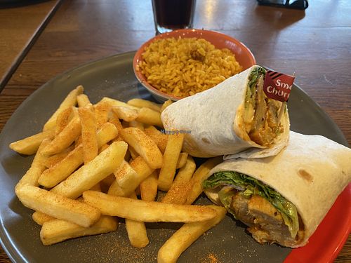 Great imitator chicken wrap with sides: spicy rice and seasoned fries   at Nando's in Londonderry