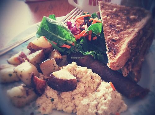 Simple breakfast made vegan ( tofu scramble, vegan sausage, dry toast). at The Wallflower Modern Diner in Vancouver