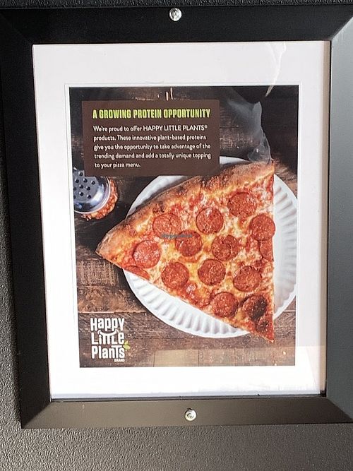 Article inside restaurant regarding plant based (vegan) meat option at University Pizza Company in Riverside