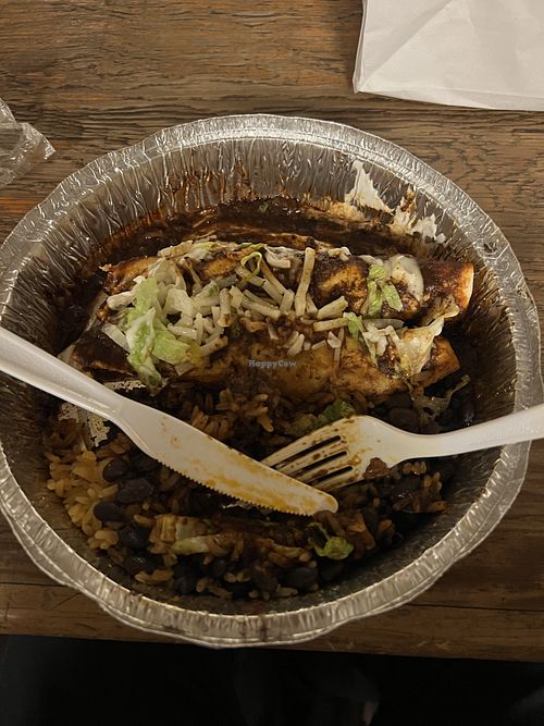 Vegan Enchilada with Vegan Chorizo, Mole, Black Beans and Mexican Rice.  at Serrano Salsa in New York City