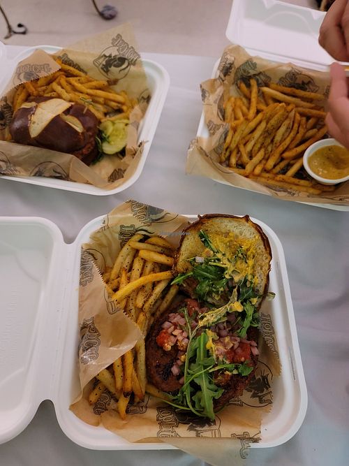 Impossible burger with jalepeno mayo and pretzel bun and seasoned fries, all vegan at HopCat in Indianapolis