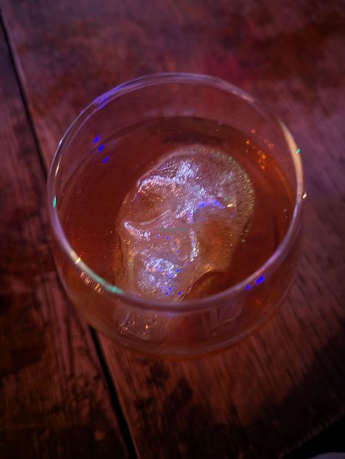 I've already forgotten the name of this cocktail, but the glittery skull ice cube was delightful. at Raven's Manor in Portland