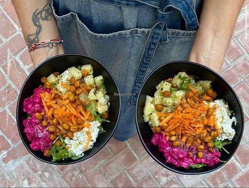 Vegan Greek Super Bowl! Homemade beet & potato salads based on a bed of Greek beans, spinach & rocket, topped with home-dried chickpeas, carrot, quinoa & our cabbage rolls! at W Karytsi in Athens