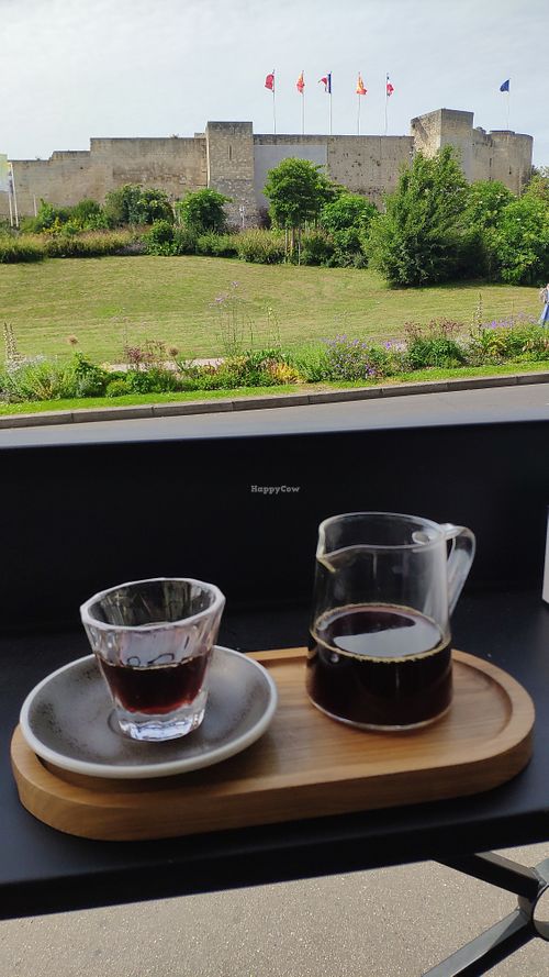 Slow coffee with the castle in the background at Arbuste in Caen